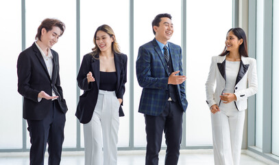 Full body shot of Millennial Asian successful professional male businessmen and female...