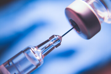 Vaccine vial dose flu shot drug needle syringe,medical concept.