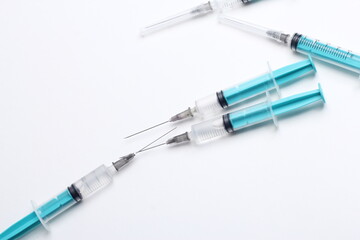 Fototapeta premium Medical syringe on a white background. A syringe for injection. The concept of health and beauty