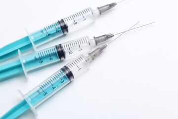 Medical syringe on a white background. A syringe for injection. The concept of health and beauty