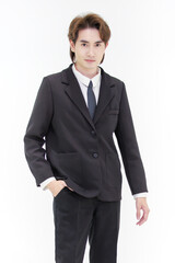 Portrait isolated cutout studio shot of Millennial Asian smart handsome successful professional male businessman in formal suit standing posing smiling put hand in pants pocket on white background