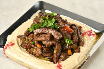 beef liver, served dry or with curry in a bowl, karahi or plate
