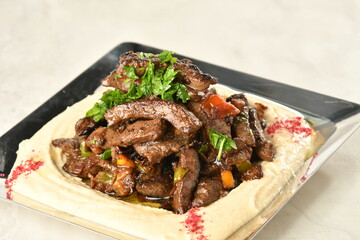 beef liver, served dry or with curry in a bowl, karahi or plate
