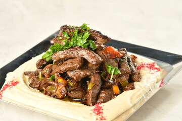 beef liver, served dry or with curry in a bowl, karahi or plate
