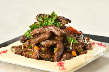 beef liver, served dry or with curry in a bowl, karahi or plate
