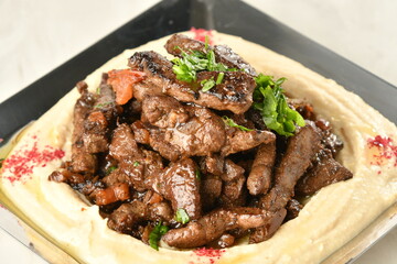 beef liver, served dry or with curry in a bowl, karahi or plate
