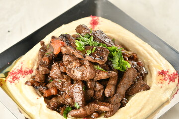 beef liver, served dry or with curry in a bowl, karahi or plate
