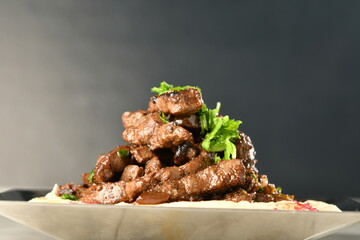 beef liver, served dry or with curry in a bowl, karahi or plate

