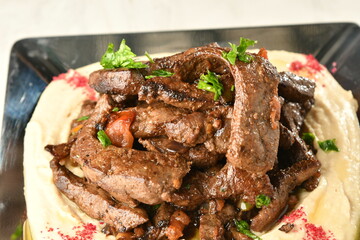 beef liver, served dry or with curry in a bowl, karahi or plate
