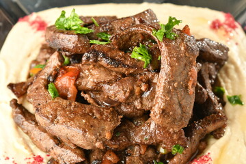 beef liver, served dry or with curry in a bowl, karahi or plate
