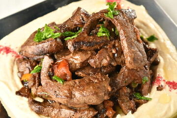 beef liver, served dry or with curry in a bowl, karahi or plate
