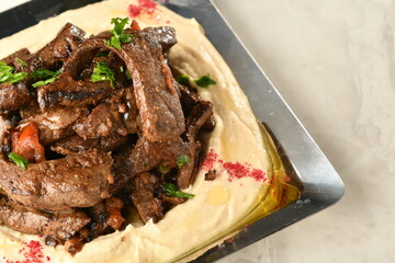 beef liver, served dry or with curry in a bowl, karahi or plate

