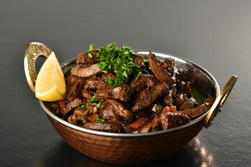 beef liver, served dry or with curry in a bowl, karahi or plate
