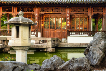Wooden pavilion at a pond in a Chinese garden