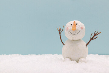 snowman on snow on blue background - obrazy, fototapety, plakaty