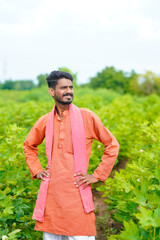 Naklejka na ściany i meble young indian farmer at cotton agriculture field.