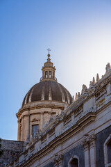 Fototapeta na wymiar Cupola of Catania Cathedral against blue sky in Sicily, Italy