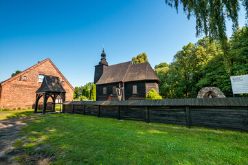 Fototapeta na wymiar Church of Saint Apostles Peter and Paul in Roznow, village in Opole Voivodeship, Poland.