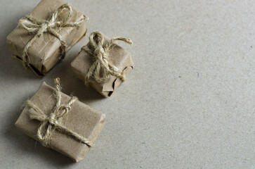 minimalism, festive beige background with gifts for the new year and christmas mailing, background image