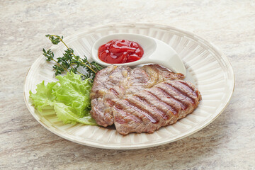Grilled pork neck steak with ketchup