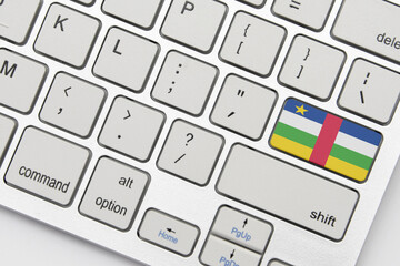 national flag of central african republic on the keyboard on a grey background .3d illustration