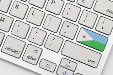 national flag of djibouti on the keyboard on a grey background .3d illustration