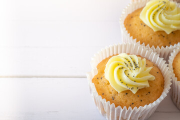 Closeup of Lemon and Poppy Seed Muffins from Above with Selective Focus and Copy Space