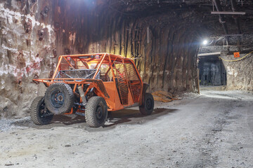 Truck for people transportation in kimberlite mine tunnel.