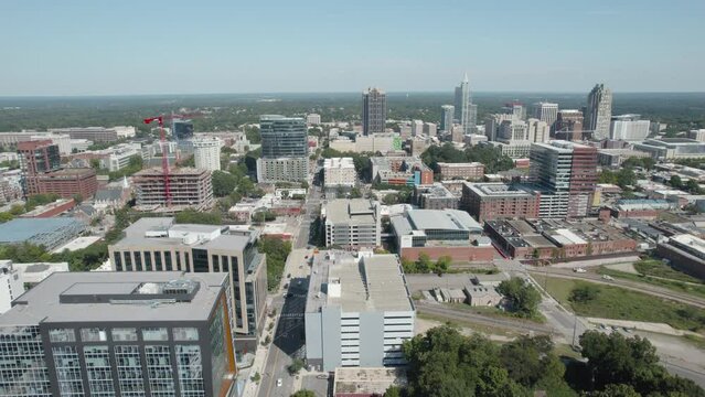 Drone shot of Downtown Raleigh North Carolina on a sunny day in the summer, aerial footage rising