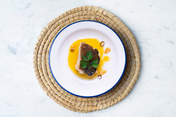 Bacalao al pil pil traditional tapa from the north of Spain. Coconut fish cooked with a delicious...