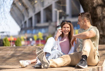 Two casual friends talking in a park