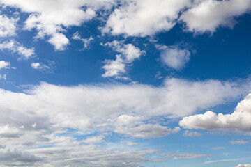 Fototapeta na wymiar Blue sky with white fluffy clouds. Blue sky after the storm.