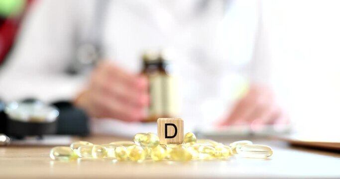 Doctor prescribing yellow gelatin capsules of vitamin d 4k movie slow motion