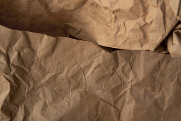 Craft crumpled brown color wrap recyclable paper texture background and space