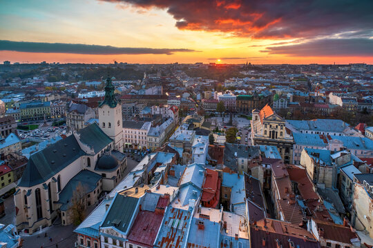 Aerial panoramic view of Latin Cathedral, Jesuit Church and old quarters in historical city center of Lviv during sunset, Lviv, Ukraine. UNESCO world heritage site