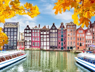 Tuinposter Amsterdam architecture at Damrak canal in autumn, Netherlands © Mistervlad