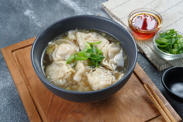 delicious of wonton soup with chili oil and green onion,chinese food,asian food style 