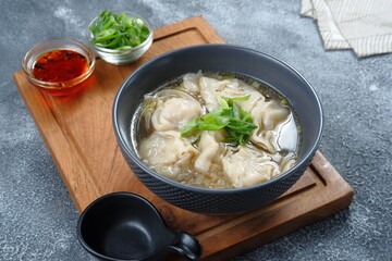 delicious of wonton soup with chili oil and green onion,chinese food,asian food style 