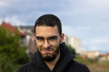 young man from side looking mischievous