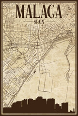 Brown printout streets network map with city skyline of the downtown MALAGA, SPAIN on a vintage paper framed background