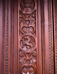 Carving detail on old wooden door