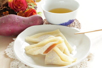 Japansese sweet food, Kyoto sweet potato paste in sticky rice in triangle shape for regional confectionery 