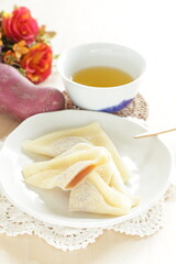 Japansese sweet food, Kyoto sweet potato paste in sticky rice in triangle shape for regional confectionery 