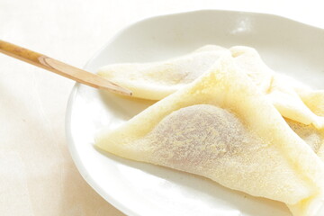 Japansese sweet food, Kyoto sweet potato paste in sticky rice in triangle shape for regional confectionery 