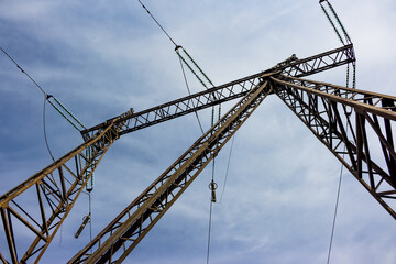 Bottom-up view of a 220 kV overhead power line tower structure