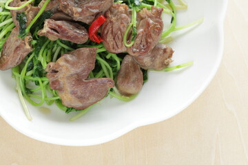 Chinese cuisine, chicken gizzard and pea sprout stir fried