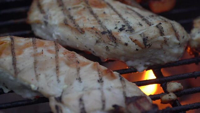 Grilling Chicken Fillet On Charcoal Griller. - close up