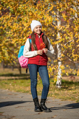 teen girl smile at school time outdoor in autumn season. full length