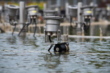 Engineering equipment of the fountain in close-up. A system of pipes and pumps for supplying pressurized water to the fountain. The period of repair work in the fountain