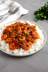 Homemade Cuban Shrimp Creole on a Plate on a gray surface, side view.